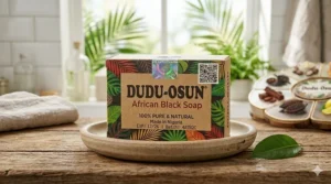 Diagram highlighting the holographic security seal and batch codes found on authentic Dudu Osun soap boxes.